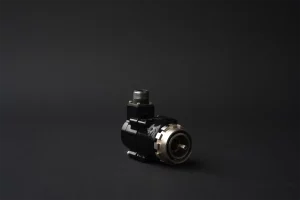 Analogue flight instrument angled to show shaft and connector detail