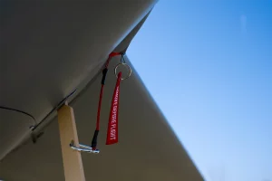 Safety tag on the Autonomous UAV MTS reading “Remove Before Flight”