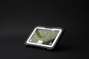 Autonomous UGV control interface running on tilted rugged tablet with live terrain feed