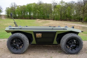 Side view of the Autonomous UGV HORNET parked in a green field