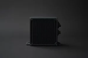 Backside of legacy diagnostic unit showing connector interface and heat dissipation grid