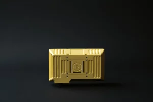 Rugged display driver unit in gold finish with reinforced metal housing and logo detail
