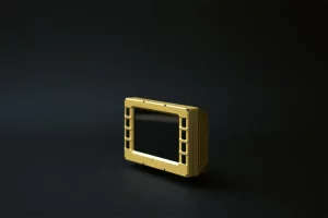 Angled view of touchscreen-capable display driver unit with rugged gold metal frame