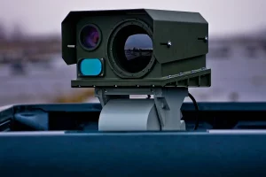 Front-facing view of SYCH multispectral imaging system with large objective lens and protective casing