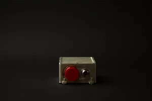 Backside of a sealed stores management system with connector covered by a protective cap