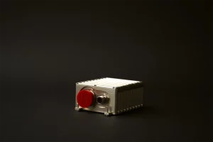 Angled view of sealed stores management unit with red cap and secondary connector