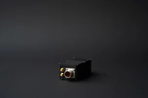 Black rectangular UAV autopilot module with military-grade connectors