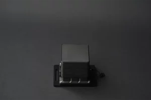 Front view of AMODIS vibration sensor on black background showing compact industrial design