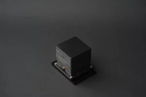 Angled view of AMODIS vibration sensor highlighting its rugged and compact design